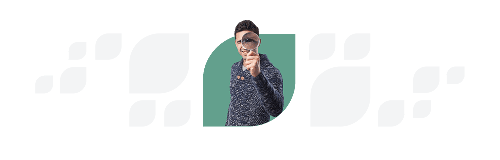 A woman in a knitted cap and sweater peers through a magnifying glass, positioned over one eye, against a split teal and white background. This image illustrates the attention to detail integral to enhancing Employee
