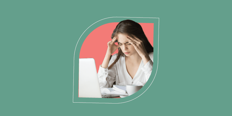 A stressed woman manages ITSM knowledge on a laptop, embodying SysAid's efficient Help Desk solutions. - SysAid