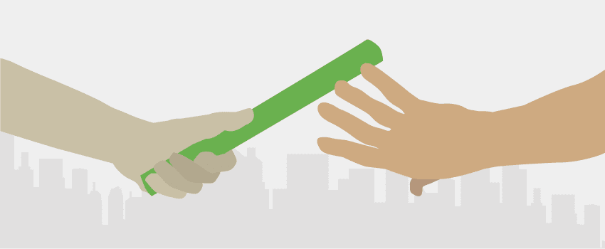 Two hands passing the baton